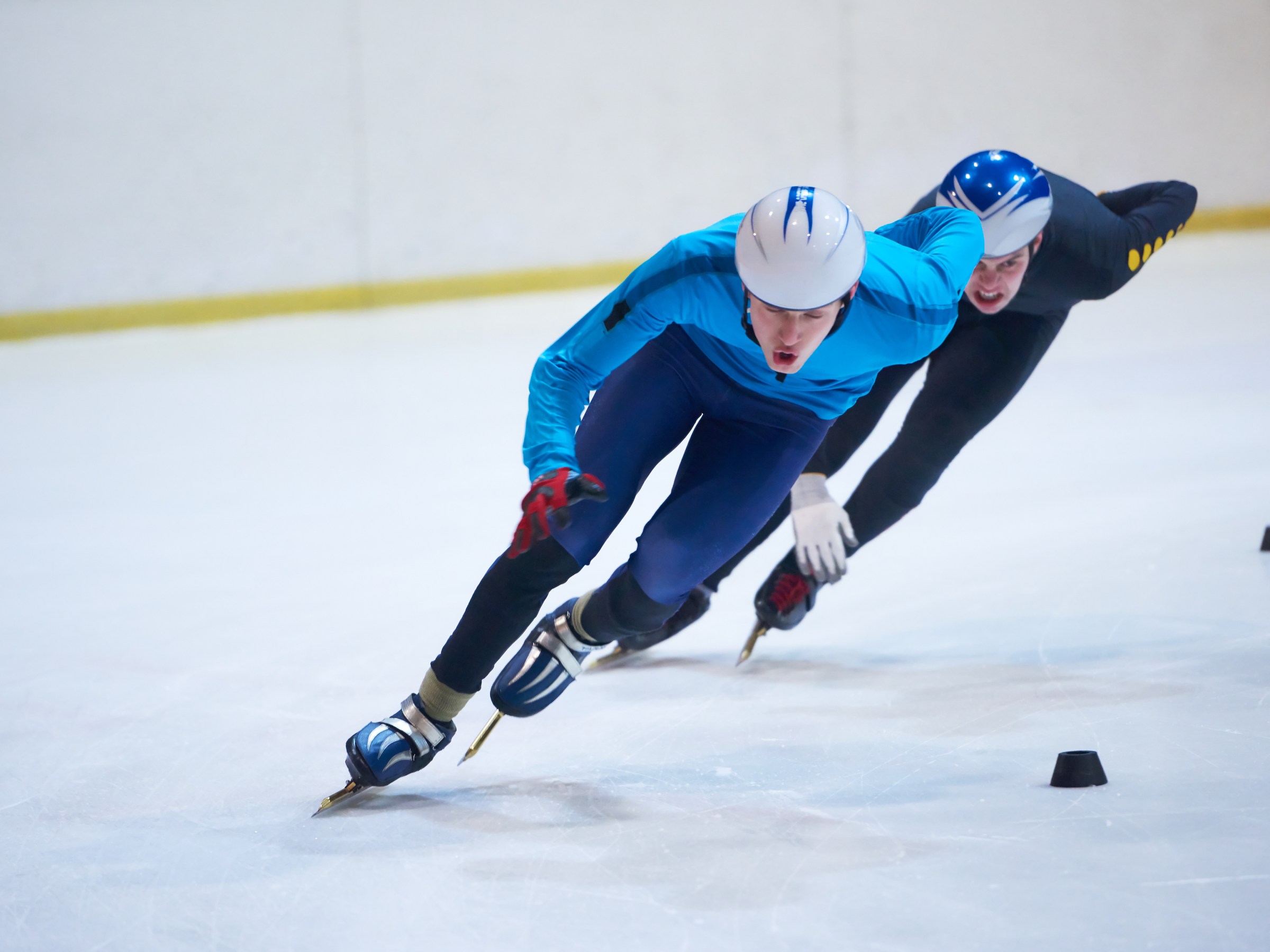 a person riding a snowboard down a snow covered slope