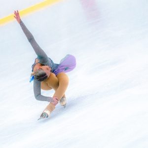 a man riding skis down a snow covered slope