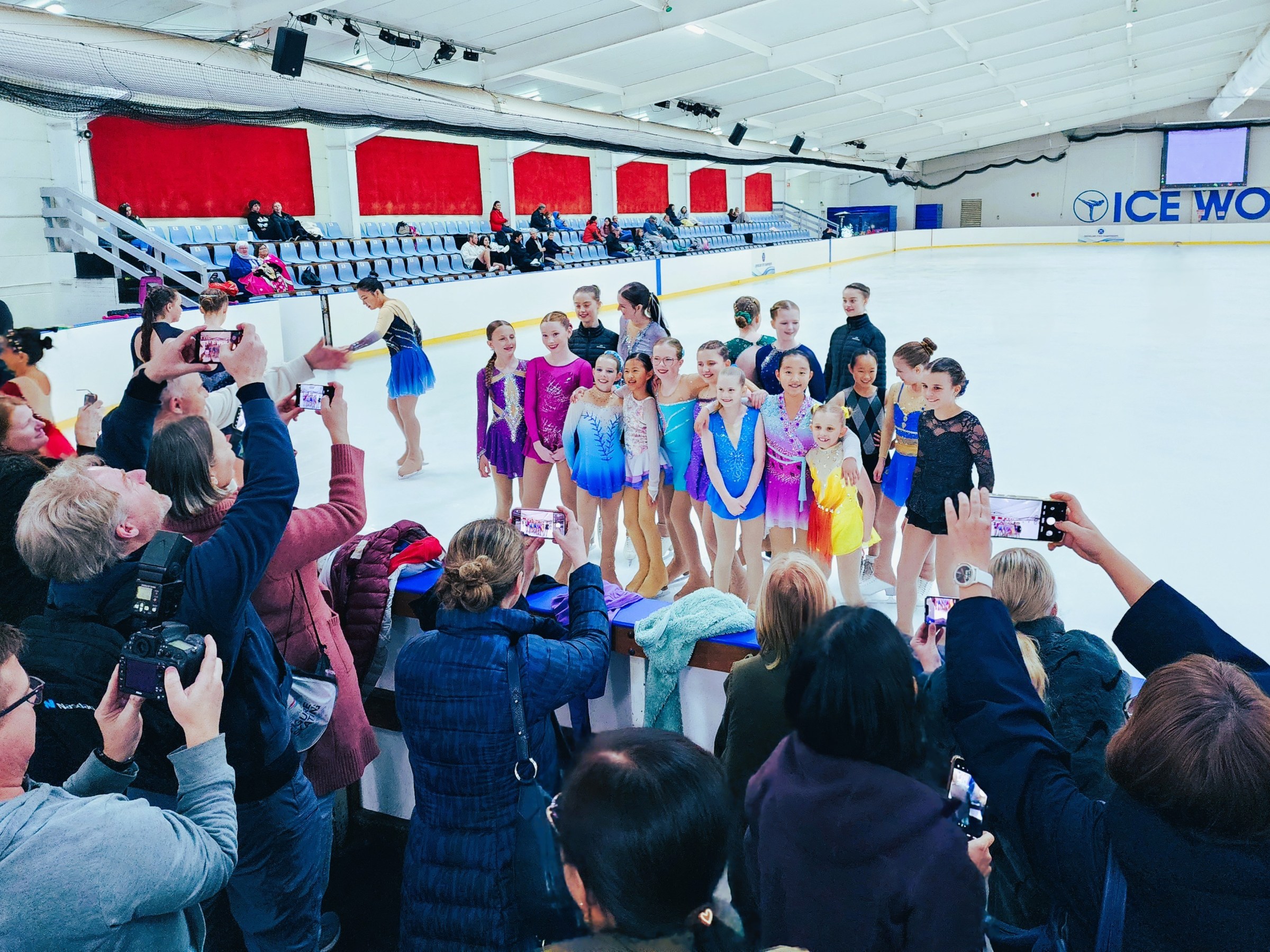 a group of people standing in front of a crowd