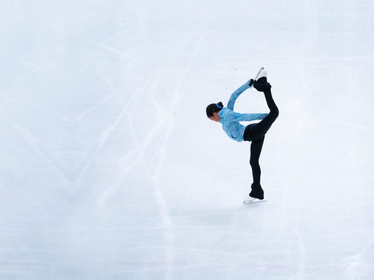 a man flying through the air while riding skis